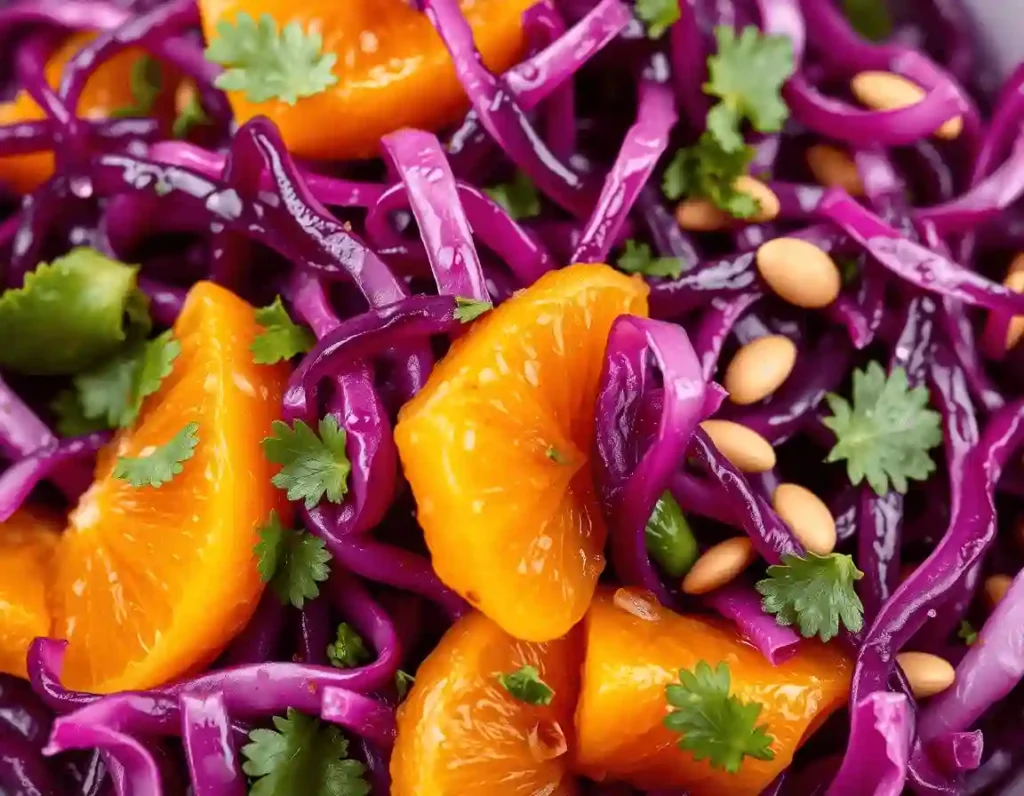 A hyper-detailed close-up of a purple cabbage salad, showcasing shredded magenta cabbage, juicy mandarin oranges, parsley flecks, and sunflower seeds coated in citrus vinaigrette.